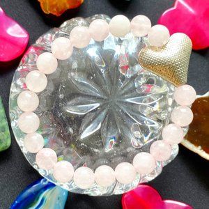 Rose Quartz precious stones with a silver in color HEART Bracelet